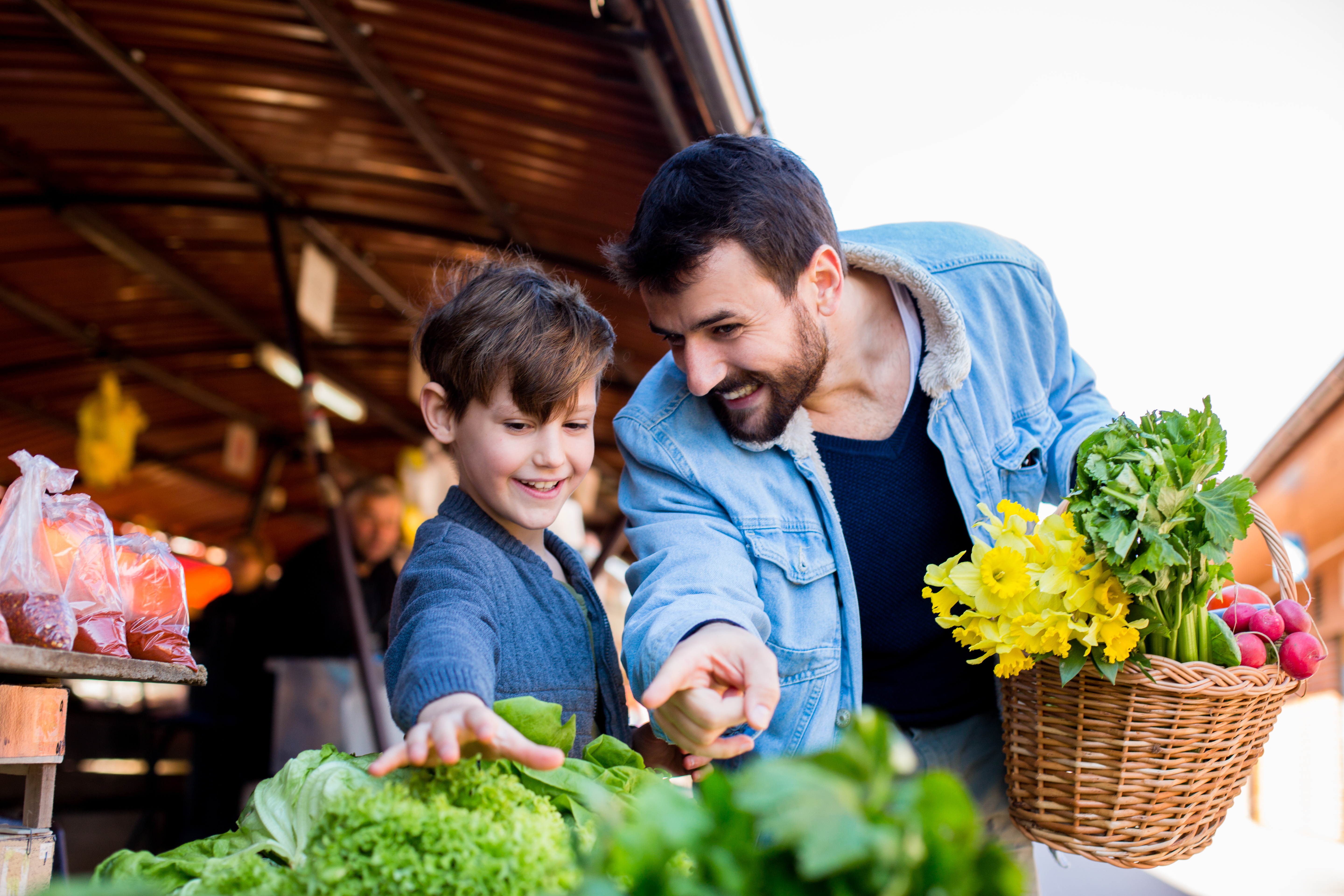 dad and son at a market