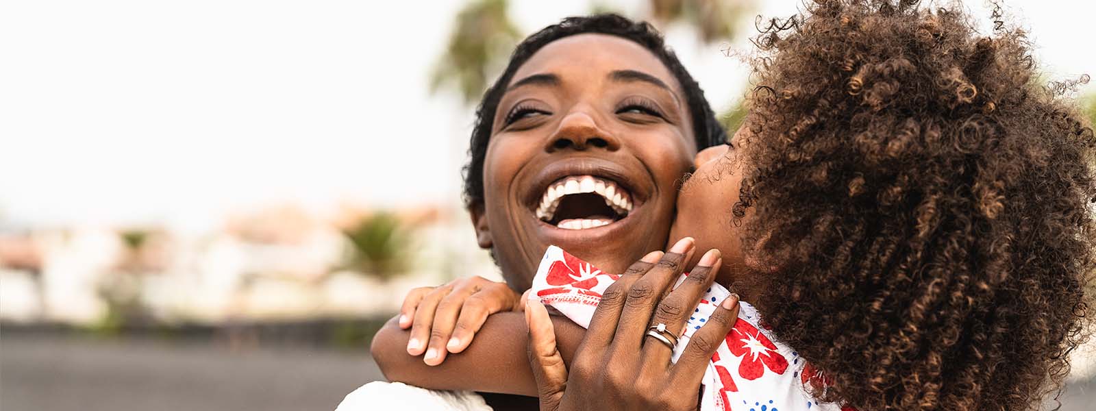 mom and daughter hugging