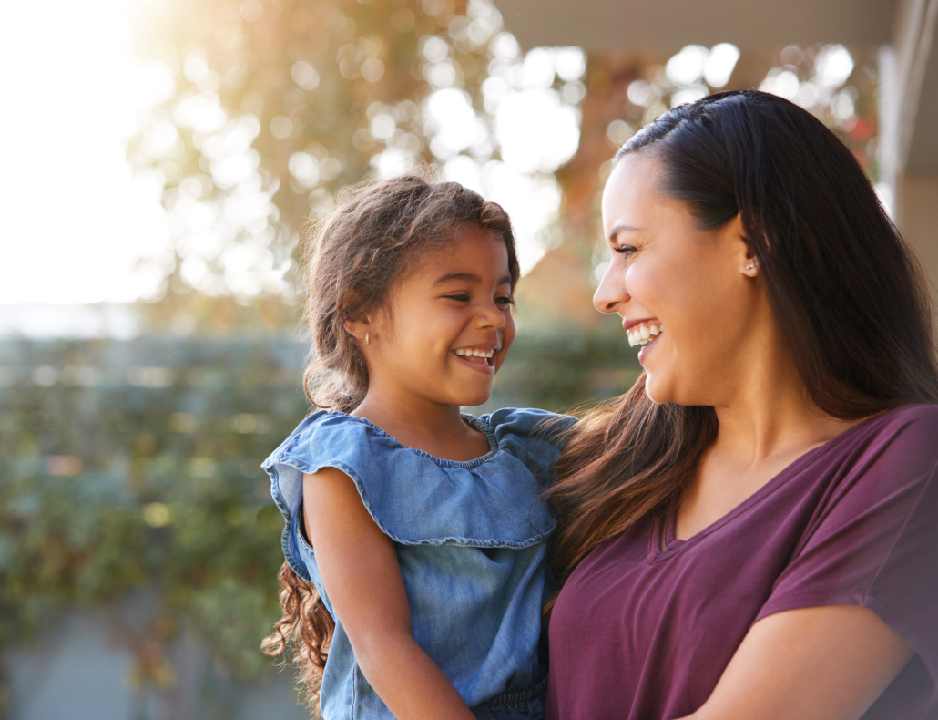Mom holding daughter