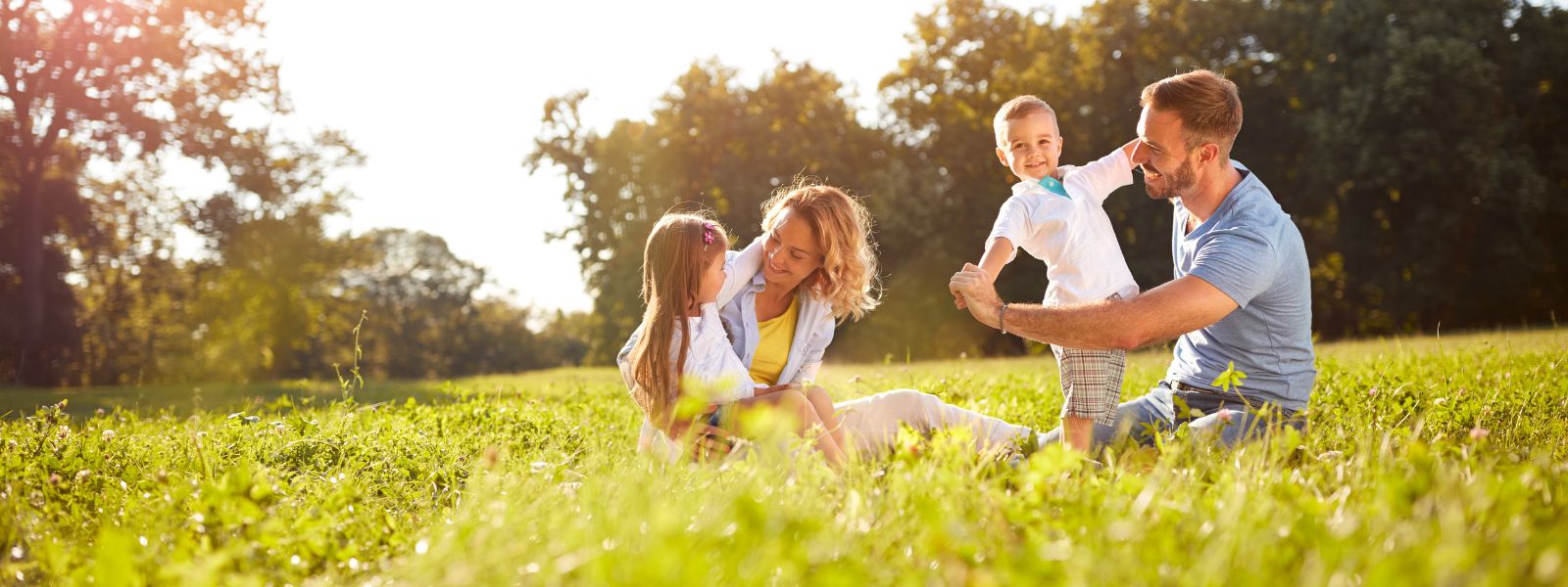 family outside with bubbles